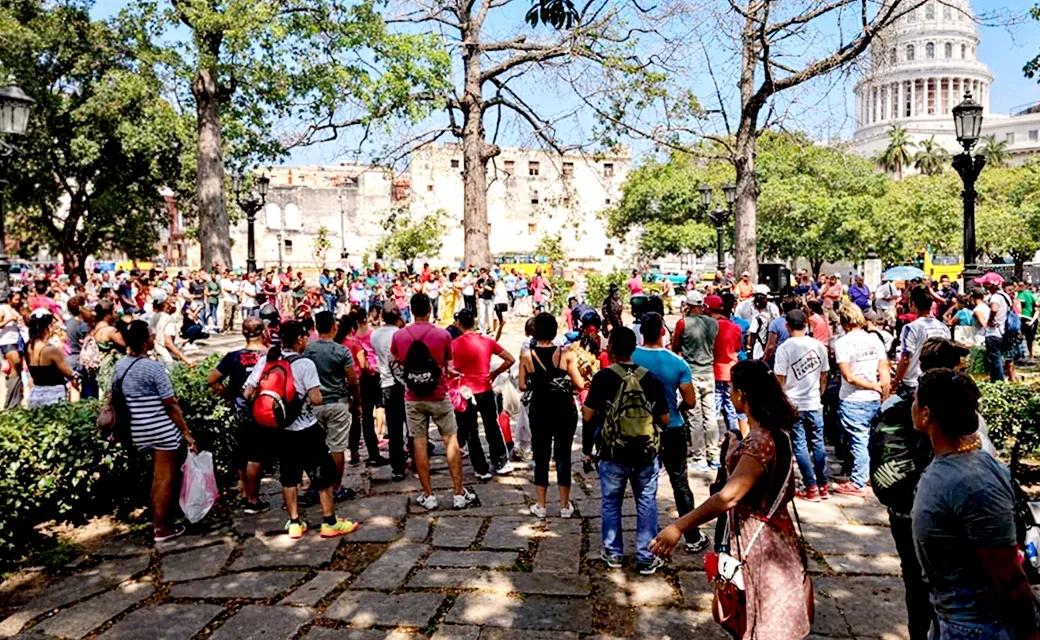 Crowd gathered outdoors in a Havana park.