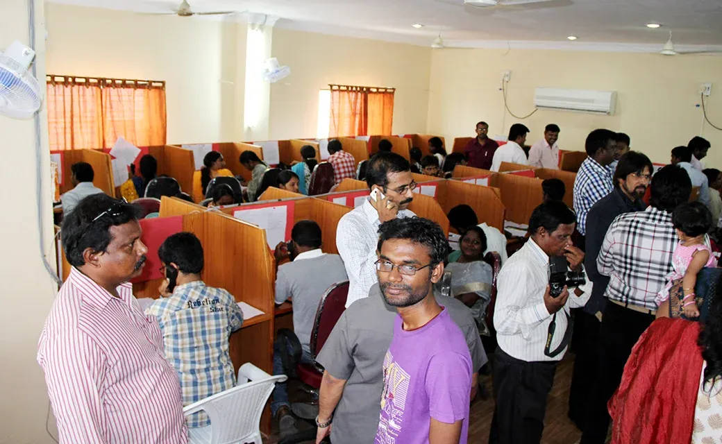 Volunteers answering phones at a campaign call centre during the Mega City Media Campaign in Hyderabad, India.