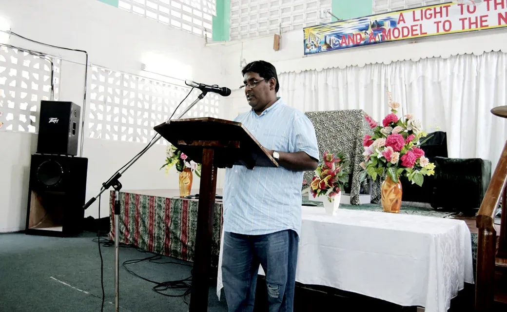 Speaker at a church gathering in Guyana during the Mega City Media Campaign.