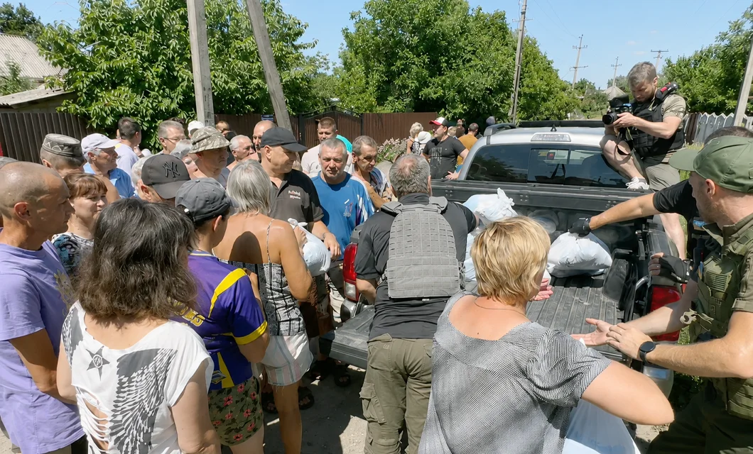 A pickup truck being used for food distribution in a frontline Ukrainian village.