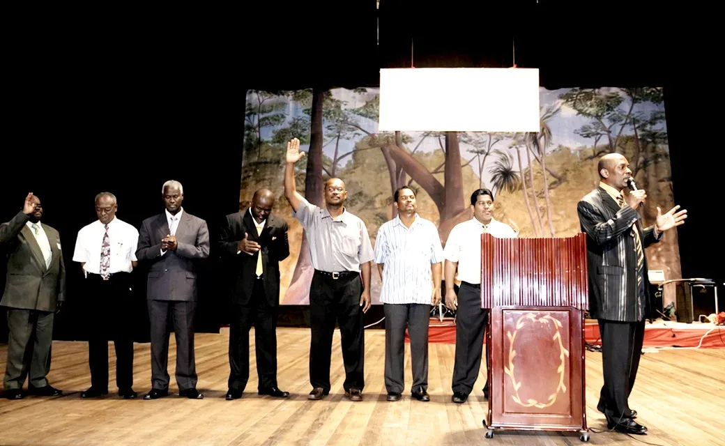 Church leaders on stage at a Power to Change Guyana event.