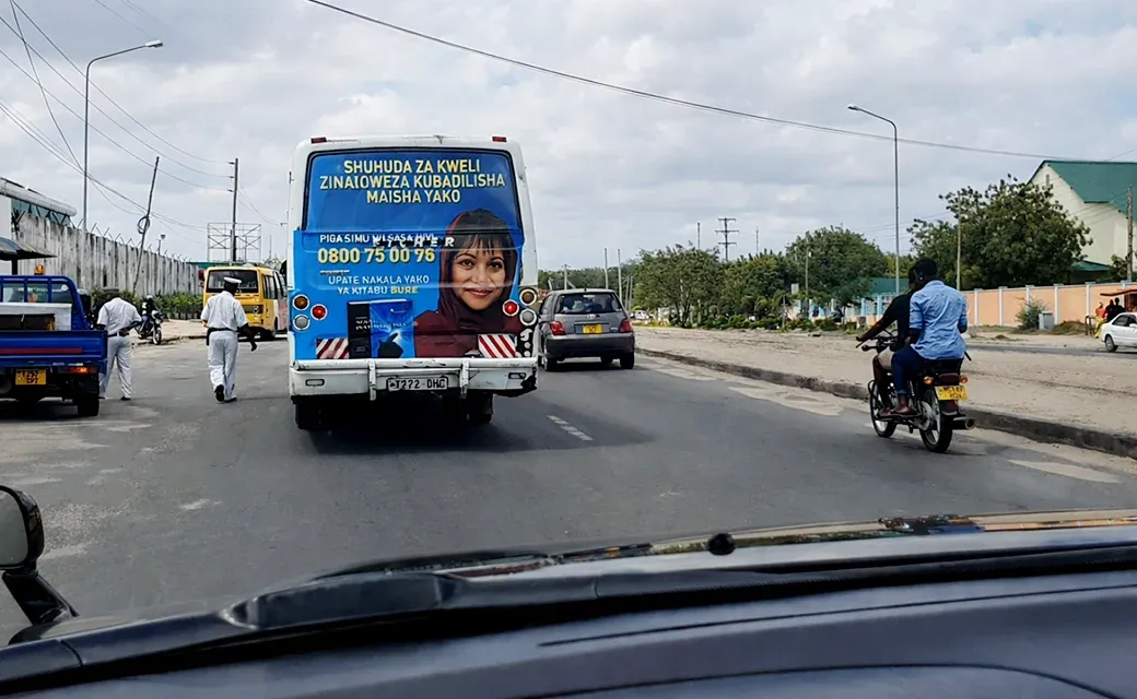 Campaign advertisement on the back of a city bus in Dar es Salaam.