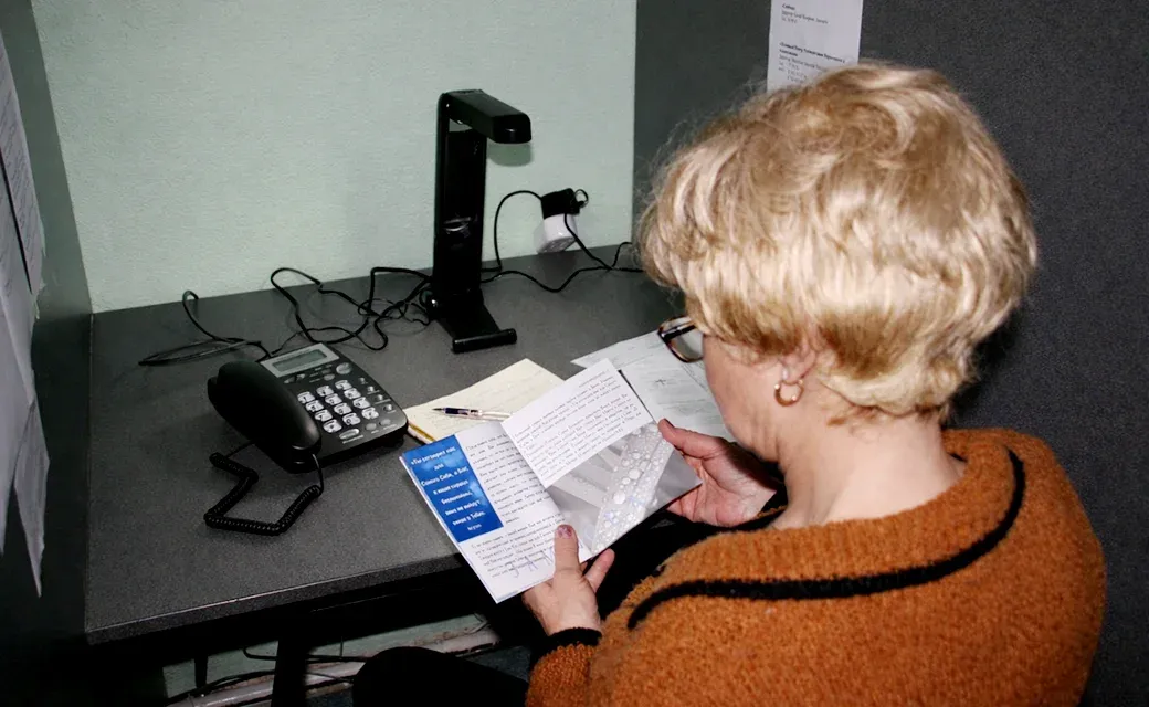 Call center desk with phone and follow-up materials.